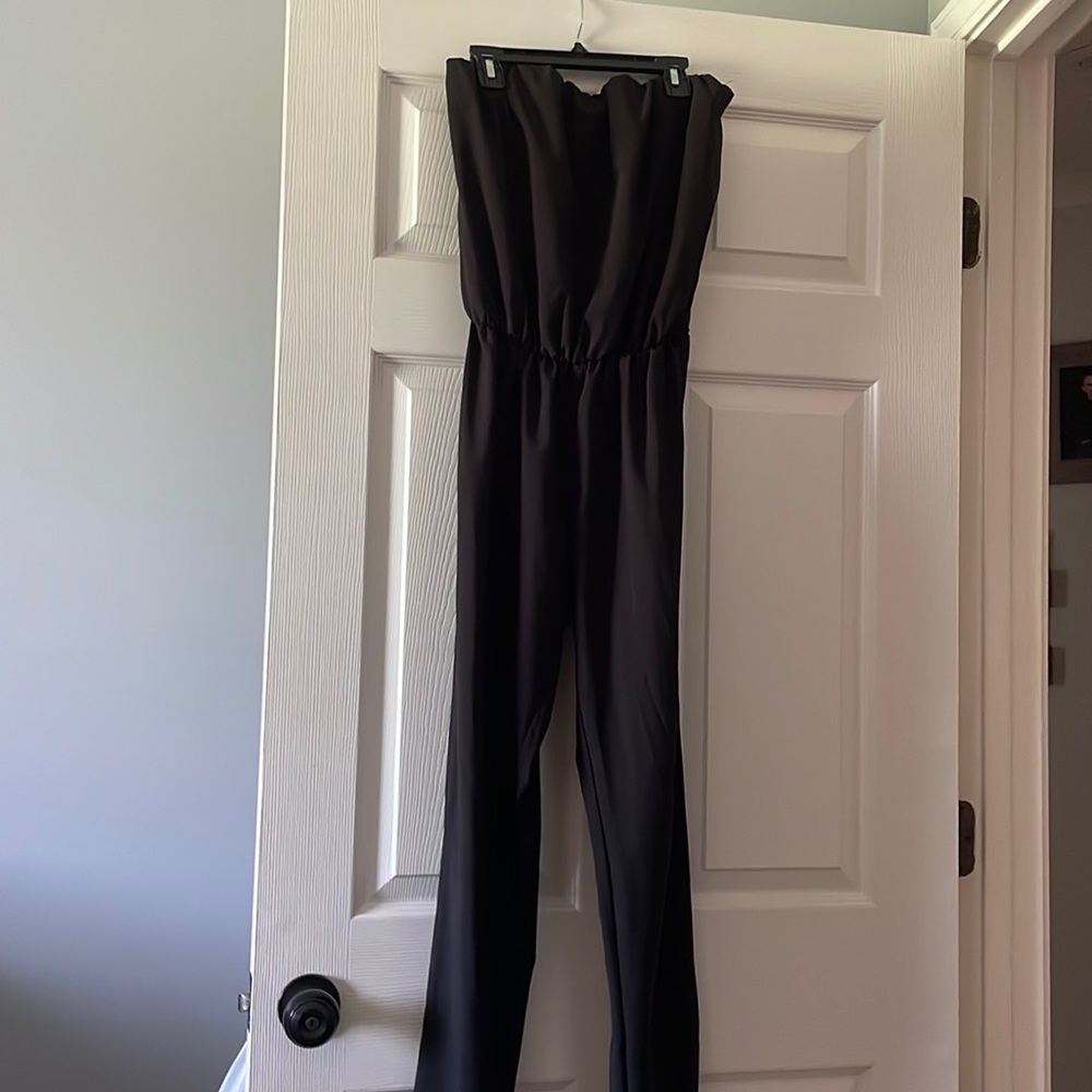 Size small strapless jumpsuit fits on me well on the legs I’m 5’3